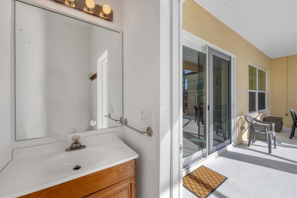 4115 Hemingway Drive Venice, FL 34293 - Photo 26 of 41 a bathroom with a sink and a mirror
