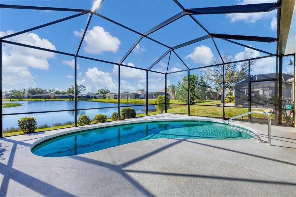 4115 Hemingway Drive Venice, FL 34293 - Photo 28 of 41 a view of a swimming pool with a porch