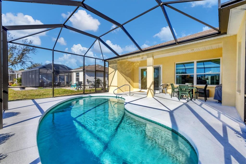 4115 Hemingway Drive Venice, FL 34293 - Photo 29 of 41 a view of a swimming pool with a patio