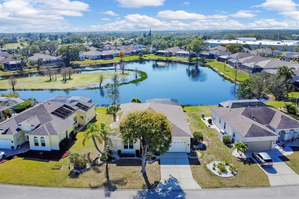 4115 Hemingway Drive Venice, FL 34293 - Photo 3 of 41 an aerial view of residential houses with outdoor space and lake view