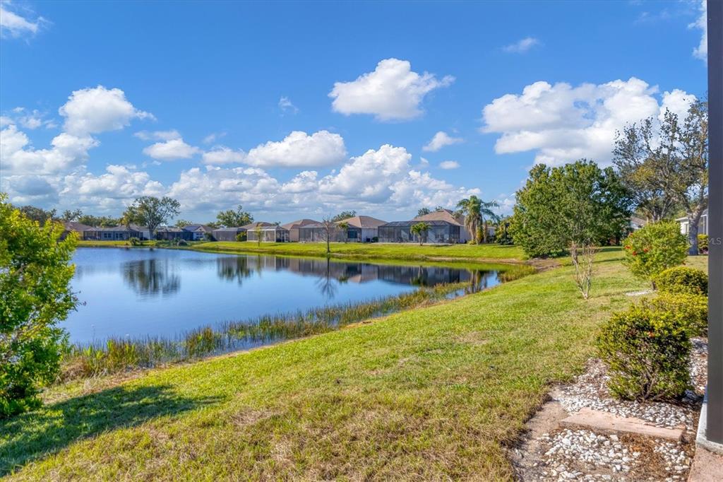 4115 Hemingway Drive Venice, FL 34293 - Photo 32 of 41 a view of a lake with houses in the back