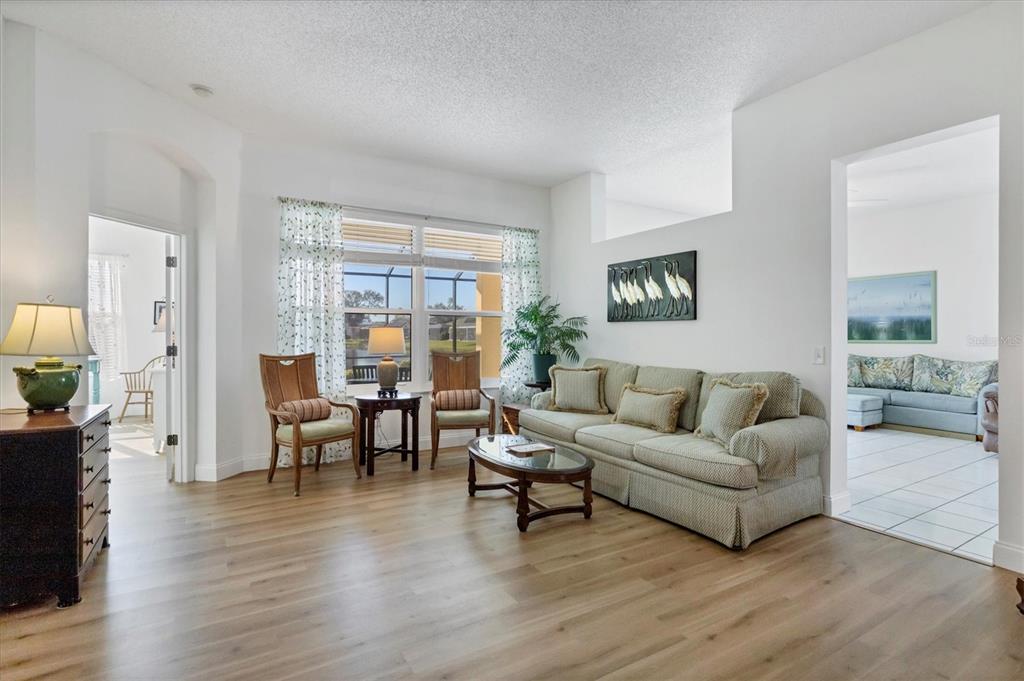 4115 Hemingway Drive Venice, FL 34293 - Photo 5 of 41 a living room with furniture and a wooden floor