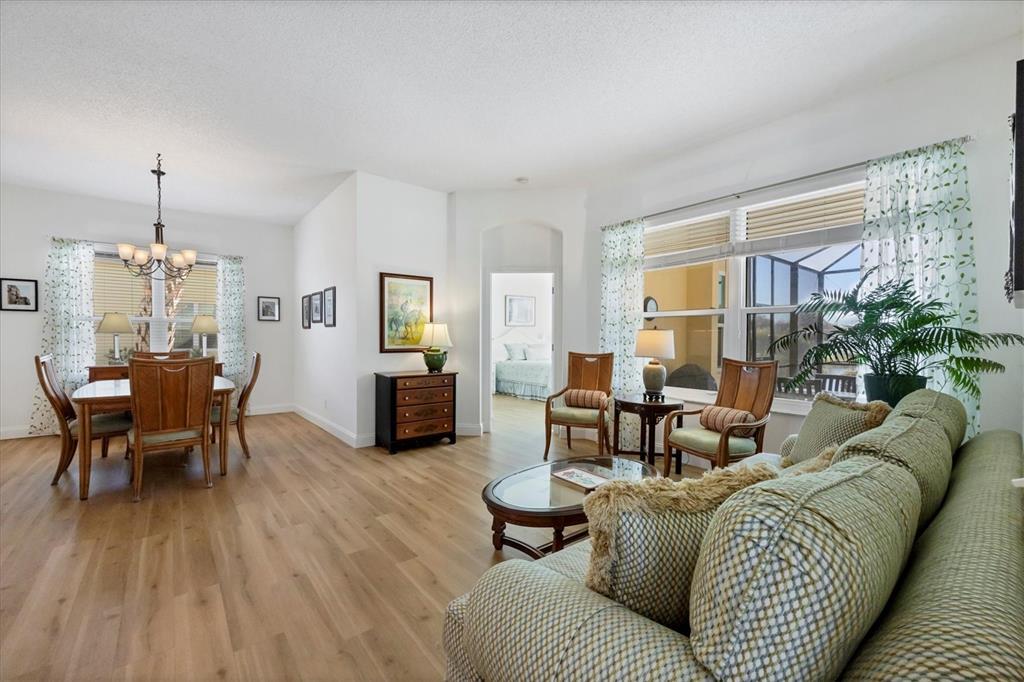 4115 Hemingway Drive Venice, FL 34293 - Photo 7 of 41 a living room with furniture and wooden floor