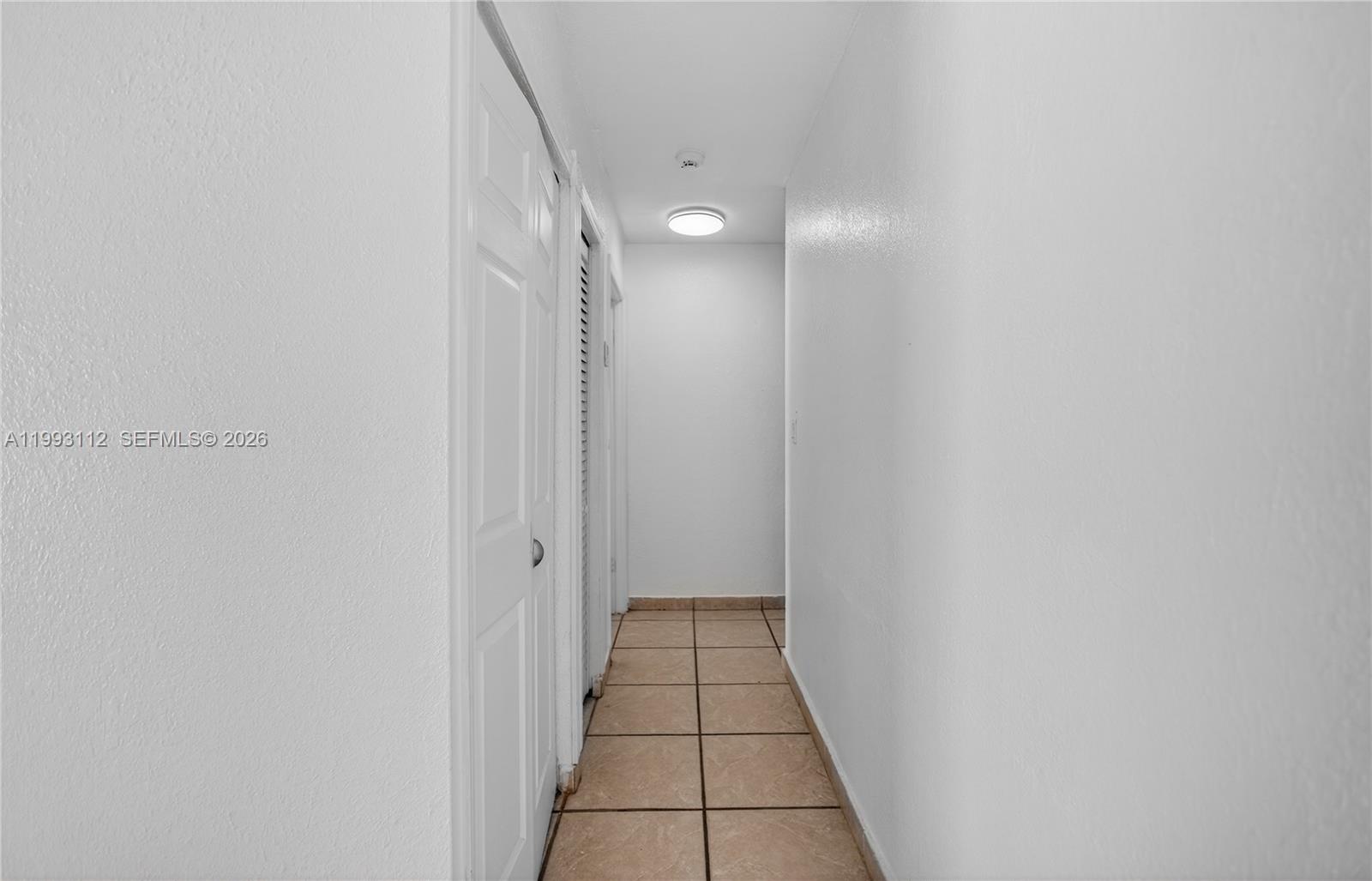 13471 Southwest 99th Terrace Miami, FL 33186 - Photo 19 of 44 a view of a hallway