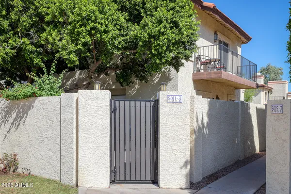 a view of a house with brick walls