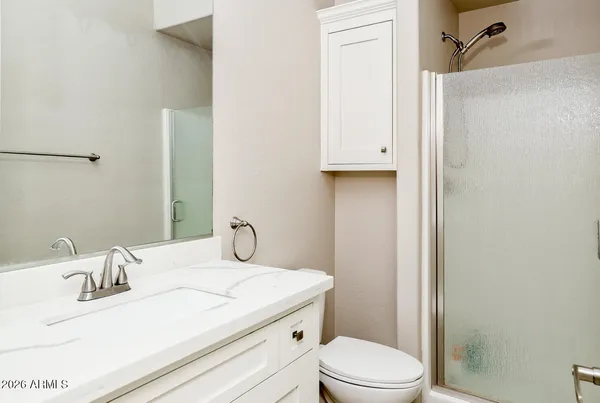 a bathroom with a sink toilet and vanity
