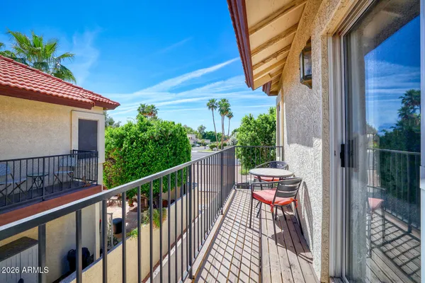 a balcony view with a potted plant