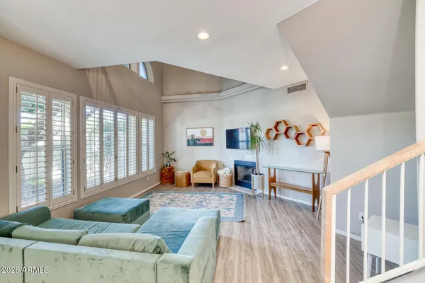 a living room with furniture and a large window