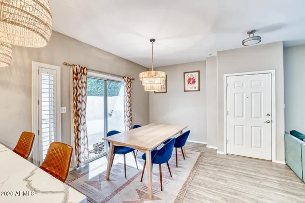 a view of a dining room with furniture window and wooden floor