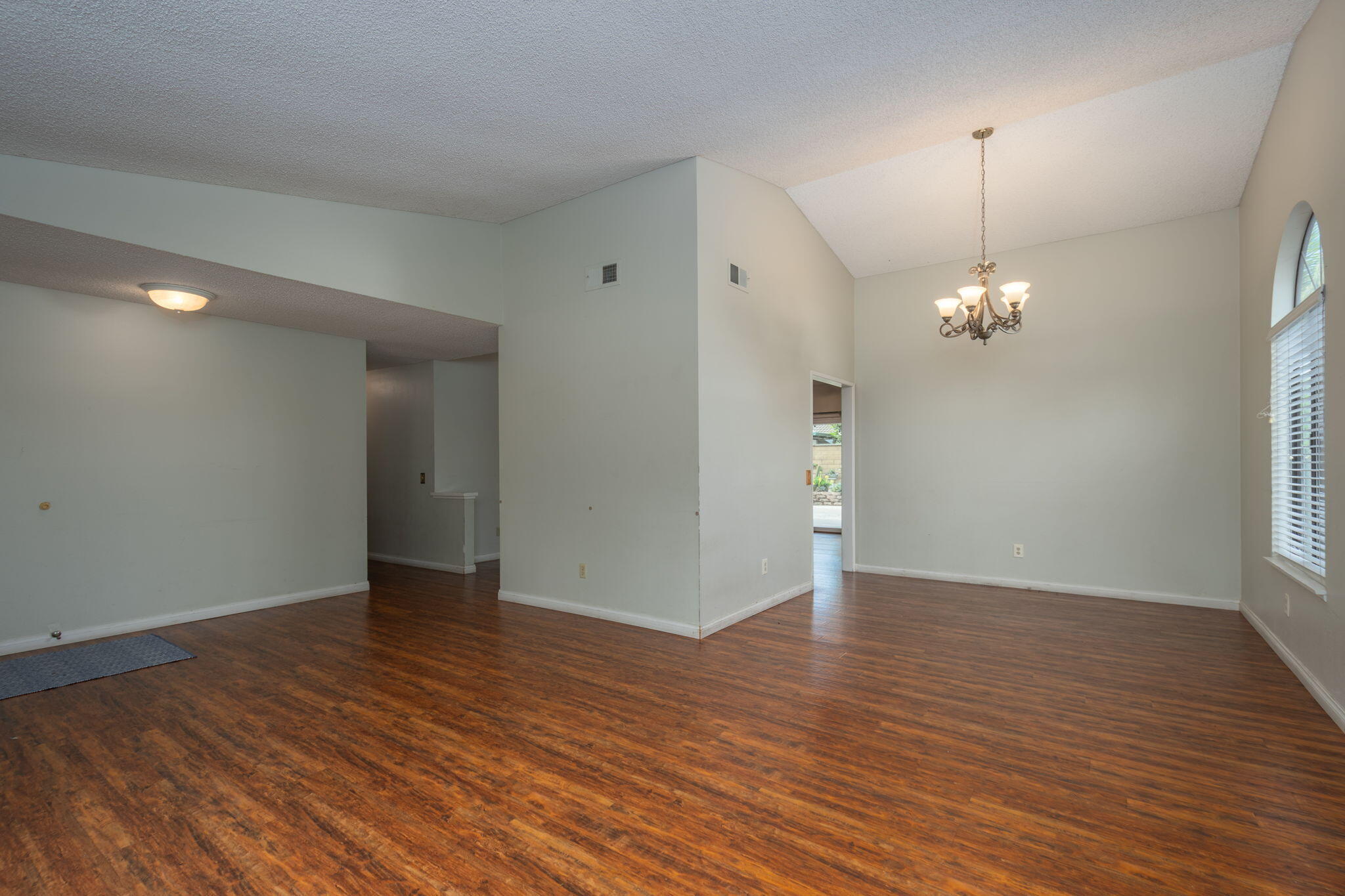 2363 Seagull Avenue Ventura, CA 93003 - Photo 16 of 37 a view of an empty room with wooden floor and a window