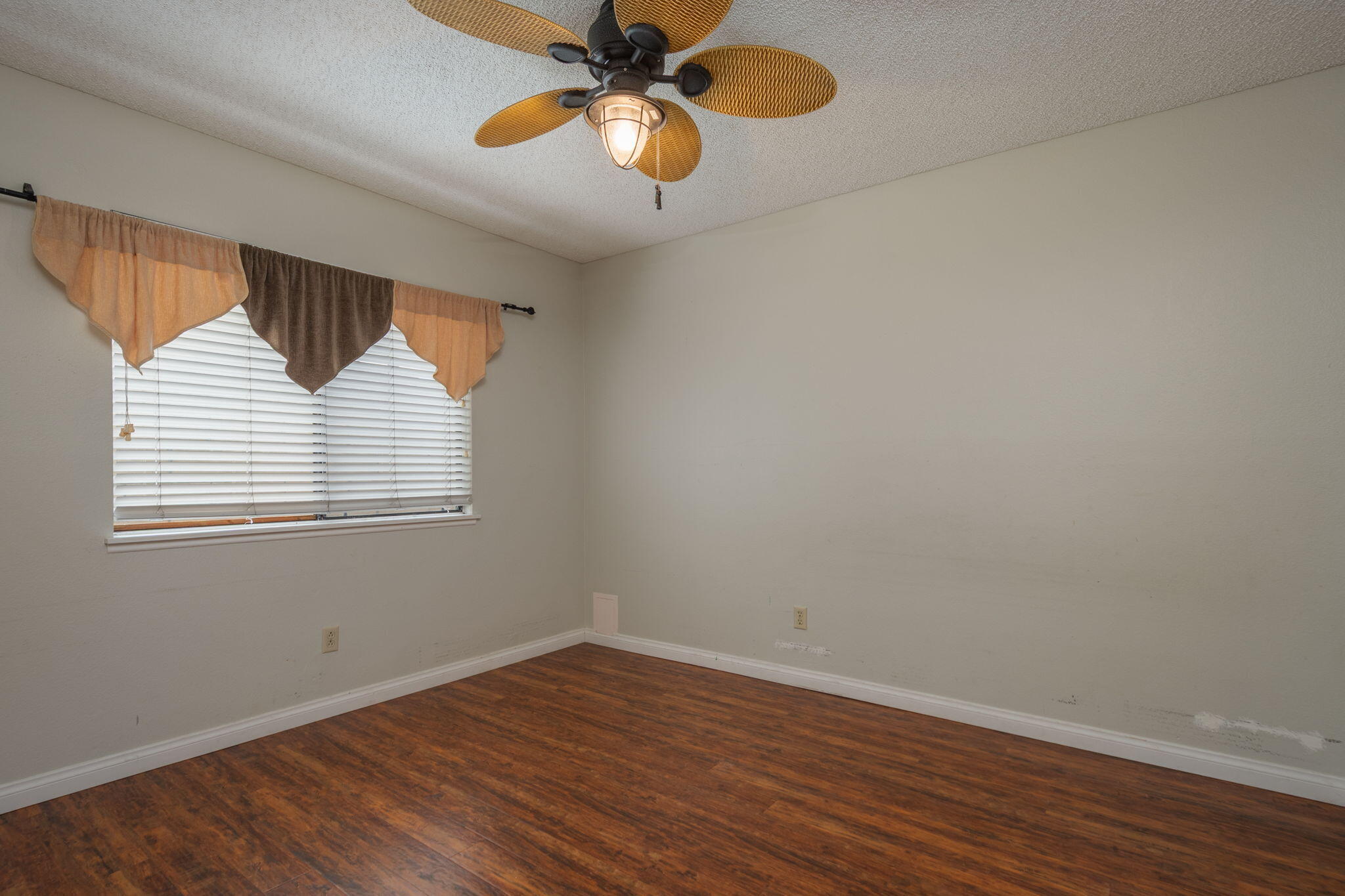 2363 Seagull Avenue Ventura, CA 93003 - Photo 25 of 37 a view of an empty room with wooden floor and a window