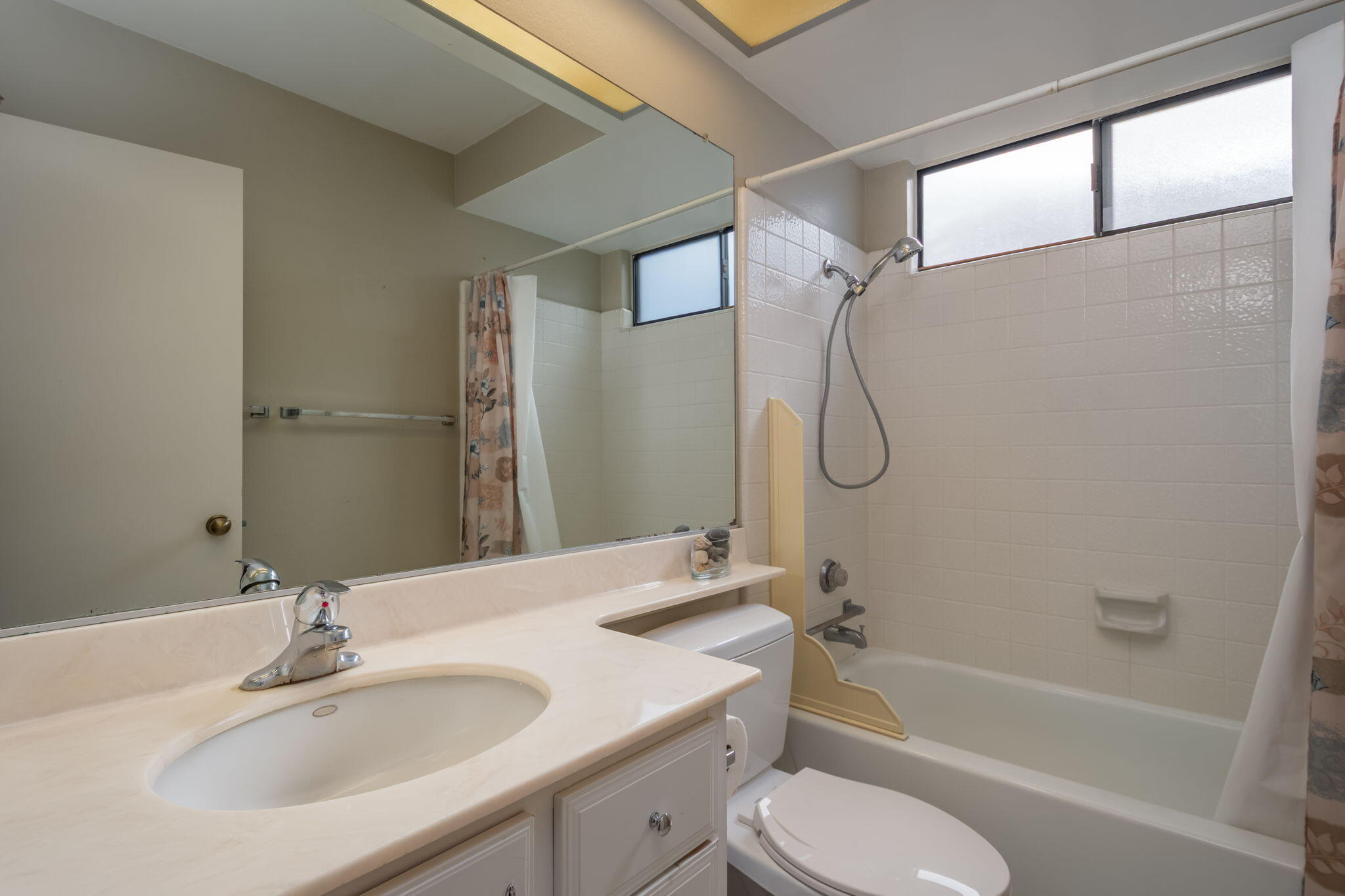 2363 Seagull Avenue Ventura, CA 93003 - Photo 26 of 37 a bathroom with a granite countertop bathtub shower sink vanity and toilet