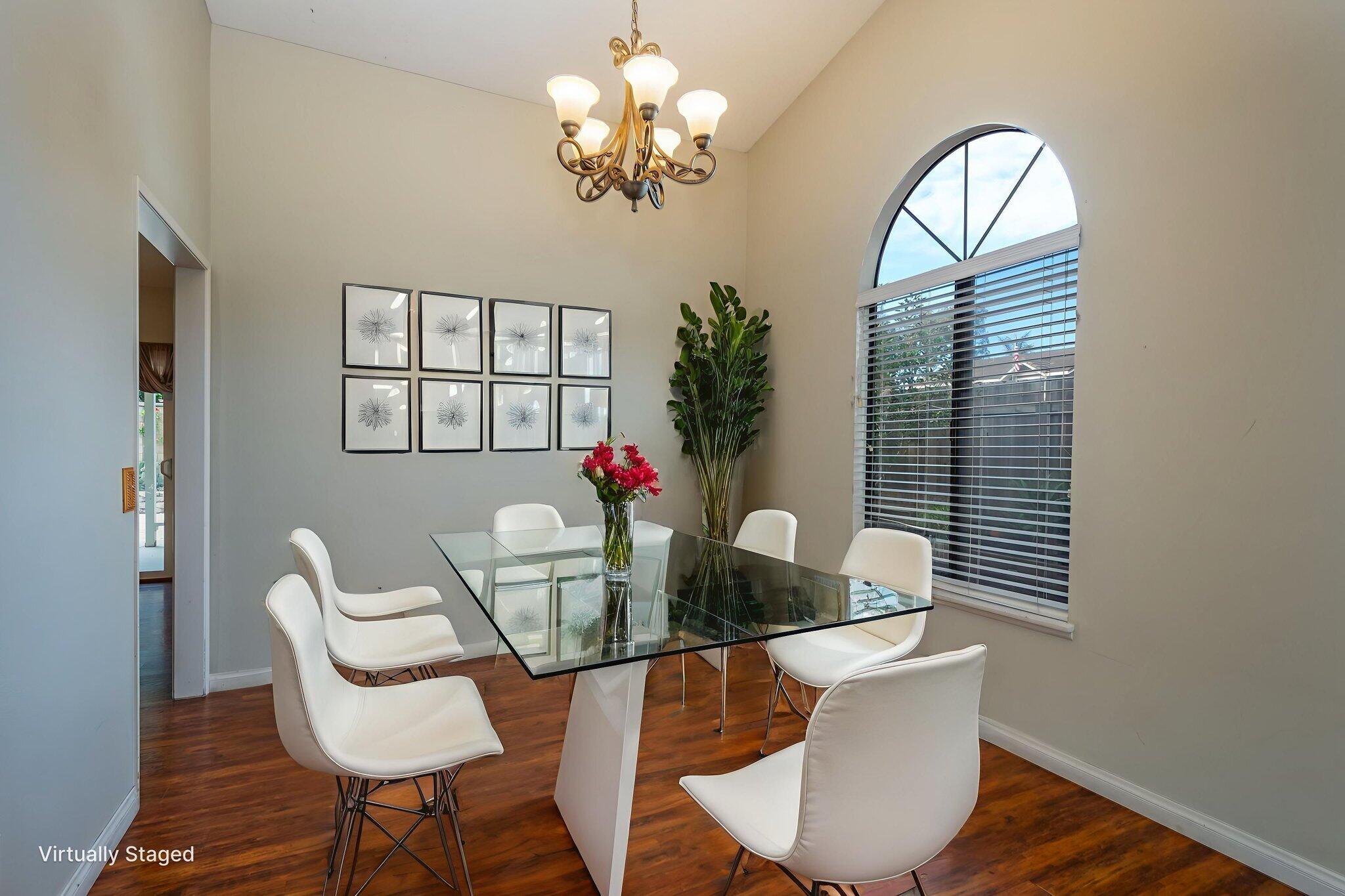 2363 Seagull Avenue Ventura, CA 93003 - Photo 4 of 37 a view of a dining room with furniture a chandelier and wooden floor
