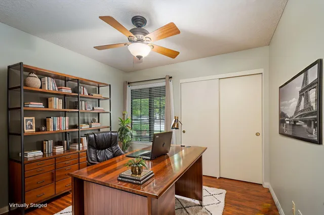 a workspace with furniture and wooden floor