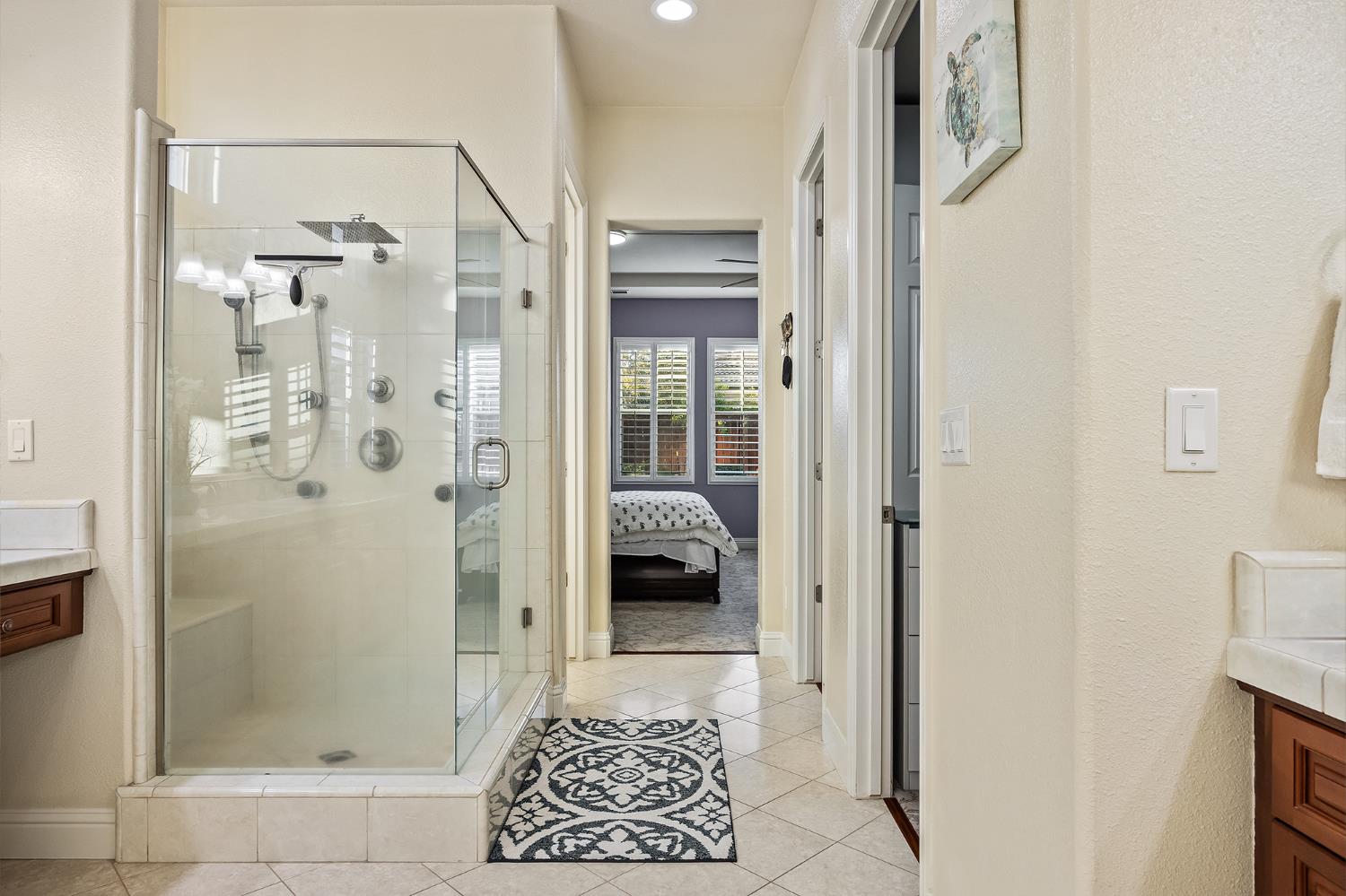 4183 North Bodega Bay Road Clovis, CA 93619 - Photo 17 of 30 a bathroom with a glass shower door