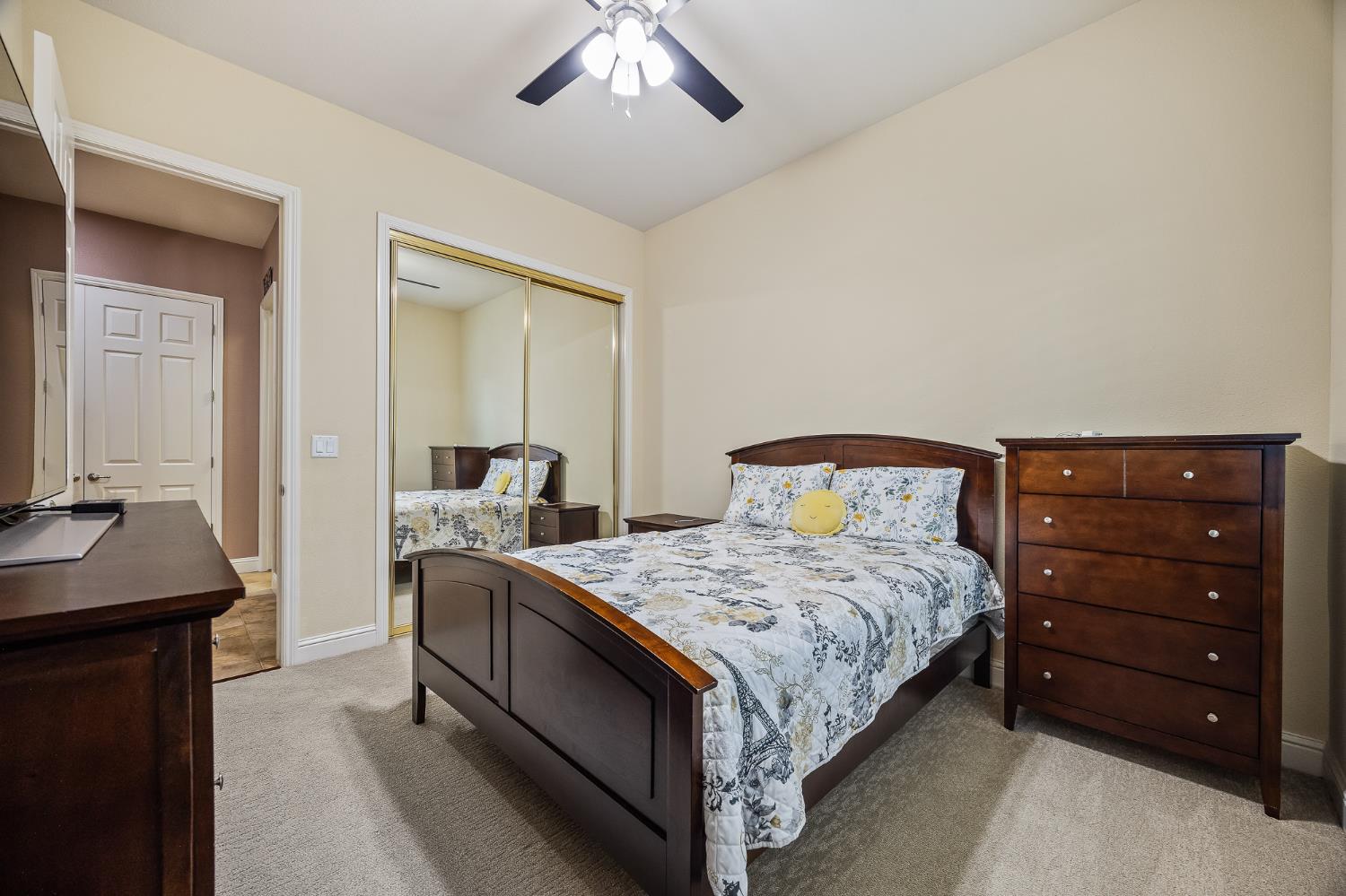 4183 North Bodega Bay Road Clovis, CA 93619 - Photo 22 of 30 a bedroom with a bed and a dresser