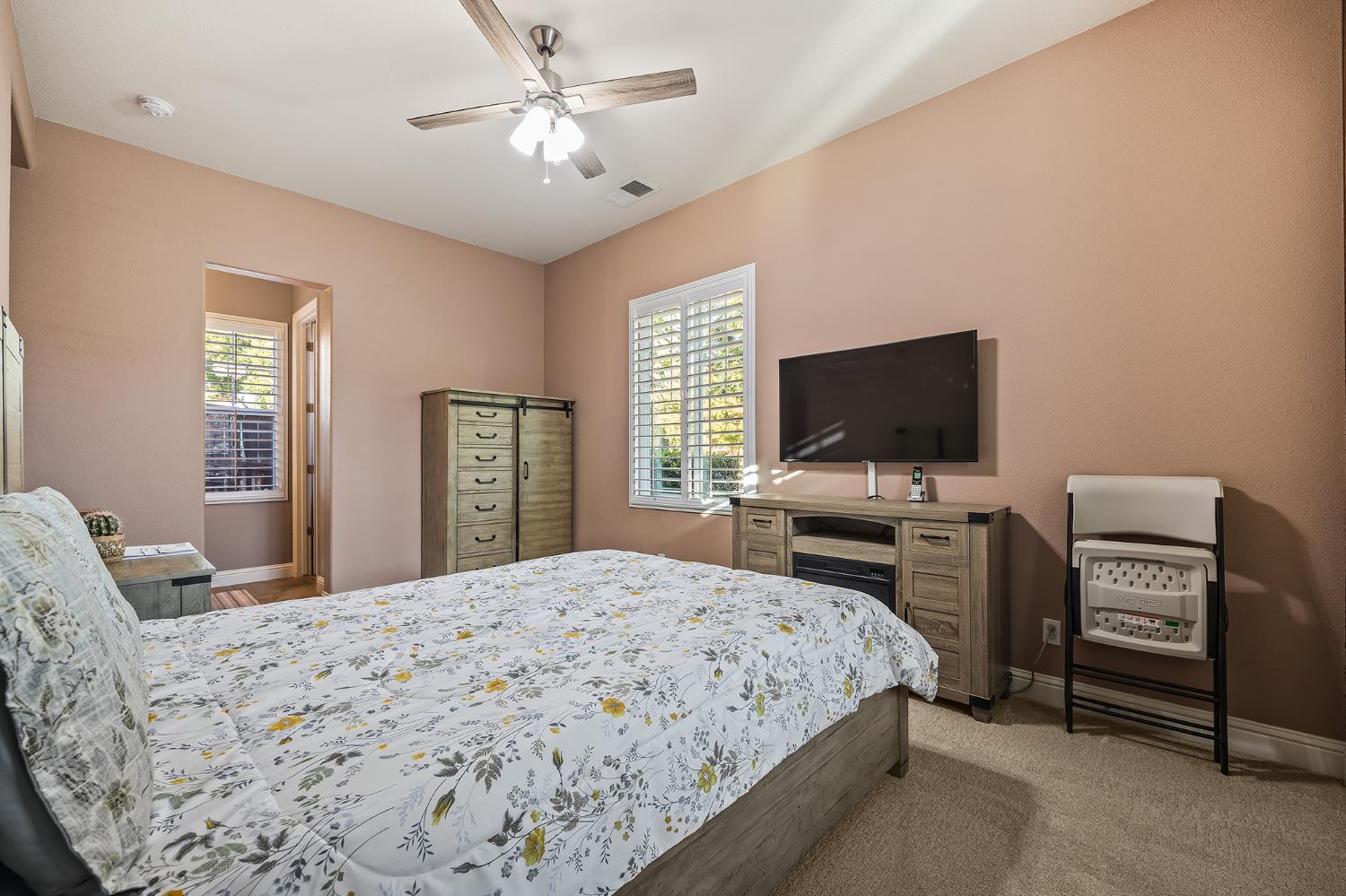 4183 North Bodega Bay Road Clovis, CA 93619 - Photo 24 of 30 a bedroom with a bed and a flat screen tv