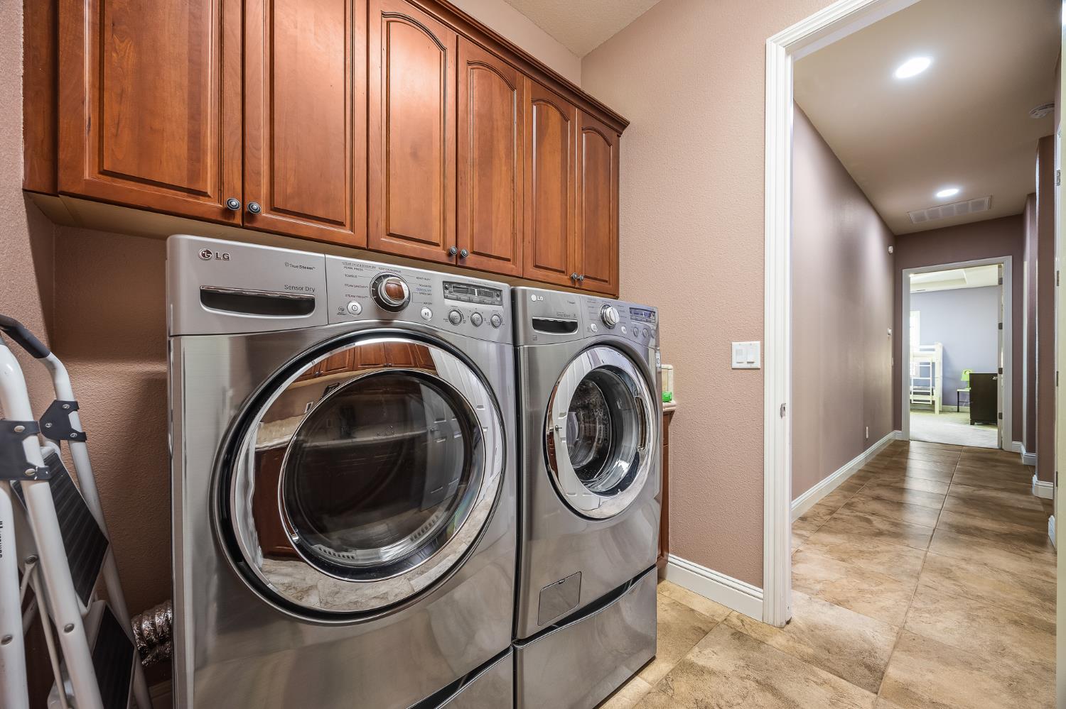 4183 North Bodega Bay Road Clovis, CA 93619 - Photo 25 of 30 a view of a hallway with washer and dryer