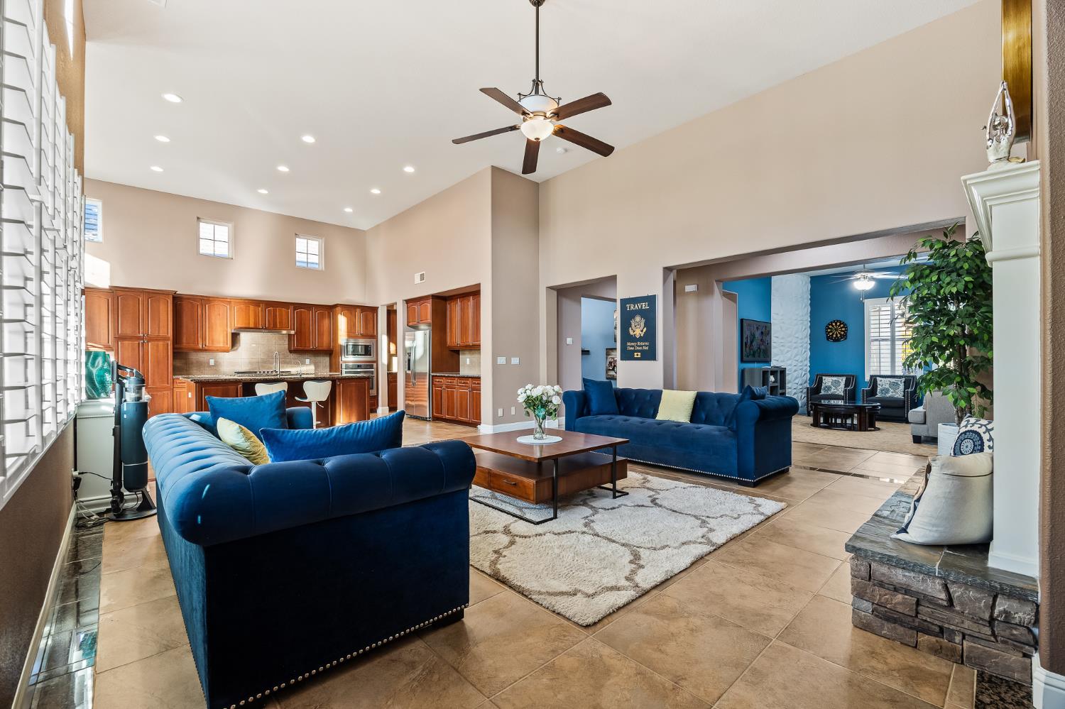 4183 North Bodega Bay Road Clovis, CA 93619 - Photo 6 of 30 a living room with furniture a ceiling fan and a window