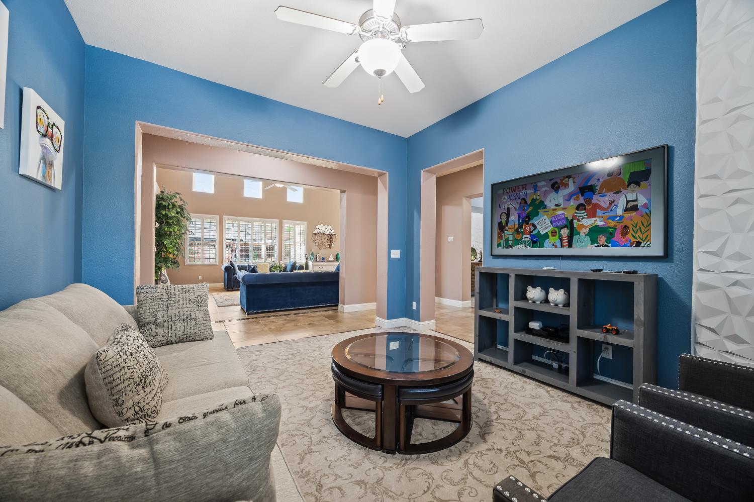 4183 North Bodega Bay Road Clovis, CA 93619 - Photo 10 of 30 a living room with furniture and a book shelf
