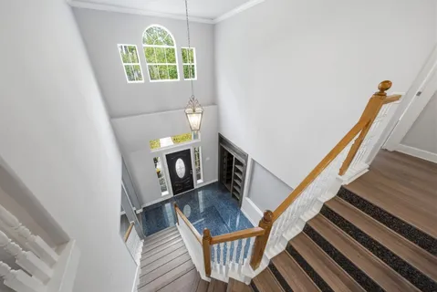 a view of an entryway with wooden floor