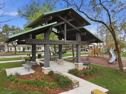 a front view of a house with a yard table and chairs