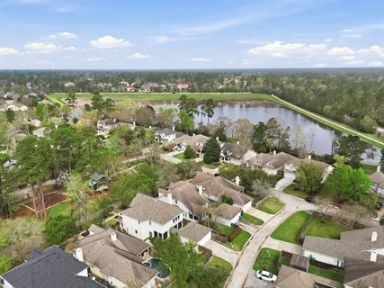 an aerial view of houses with outdoor space