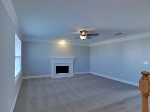 an empty room with a fireplace