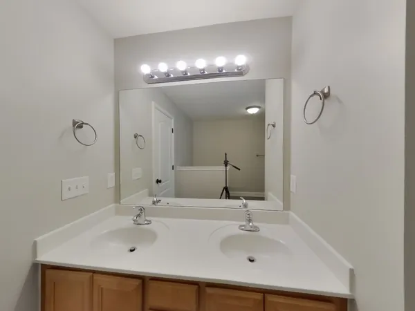 a bathroom with a bathtub and a sink