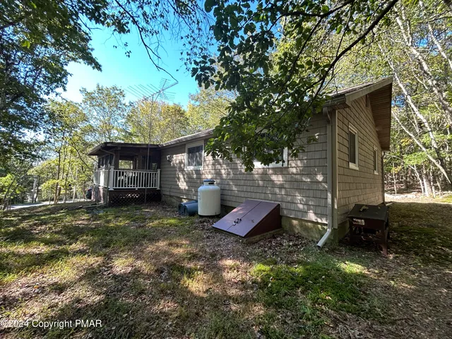 a view of a couches in backyard of house