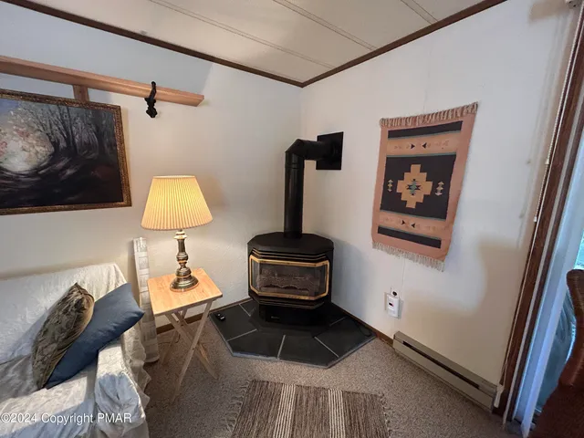 a bedroom with a bed and a lamp on the dresser