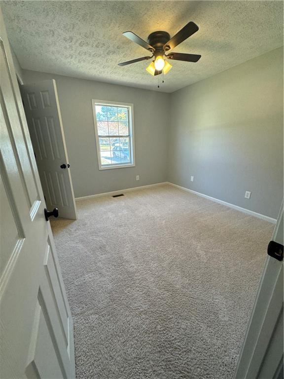 2911 Highpoint Road Snellville, GA 30078 - Photo 13 of 28 a view of an empty room and a window
