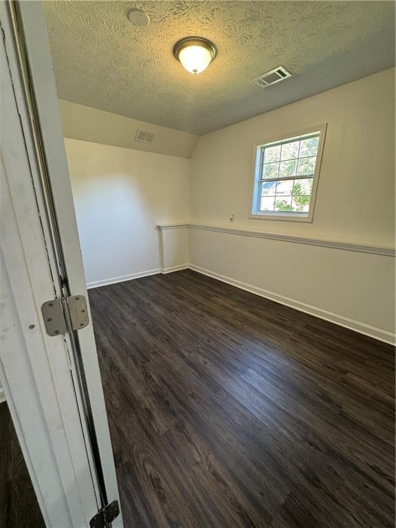 2911 Highpoint Road Snellville, GA 30078 - Photo 15 of 28 an empty room with wooden floor and windows