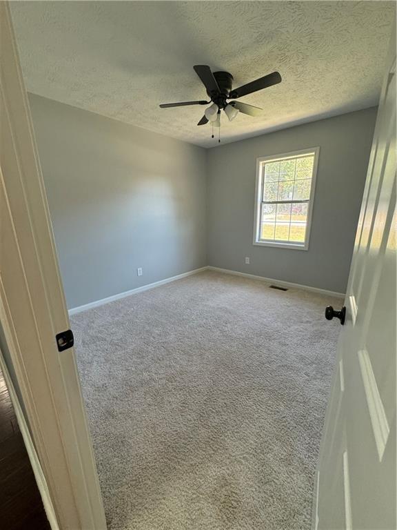 2911 Highpoint Road Snellville, GA 30078 - Photo 16 of 28 a view of a livingroom with a ceiling fan and window