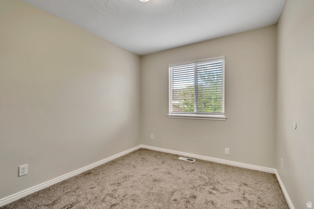 1118 North Ridge Court Spanish Fork, UT 84660 - Photo 14 of 32 Unfurnished room featuring baseboards and carpet flooring