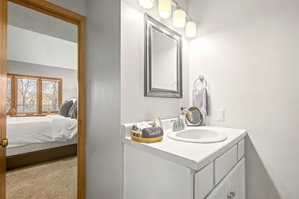 a en suite bathroom with a sink and a mirror