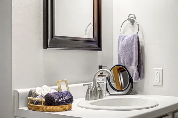 a bathroom with a sink and a mirror