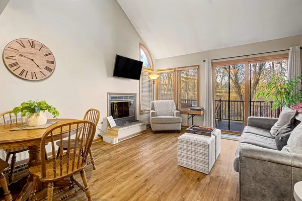 a living room with furniture fireplace and a flat screen tv