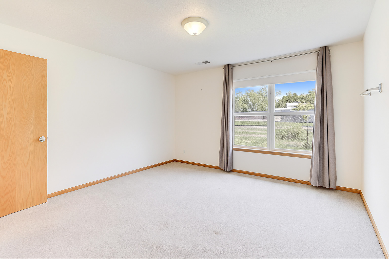 150 North Wooster Street, Unit 2 Capron, IL 61012 - Photo 16 of 17 an empty room with large window