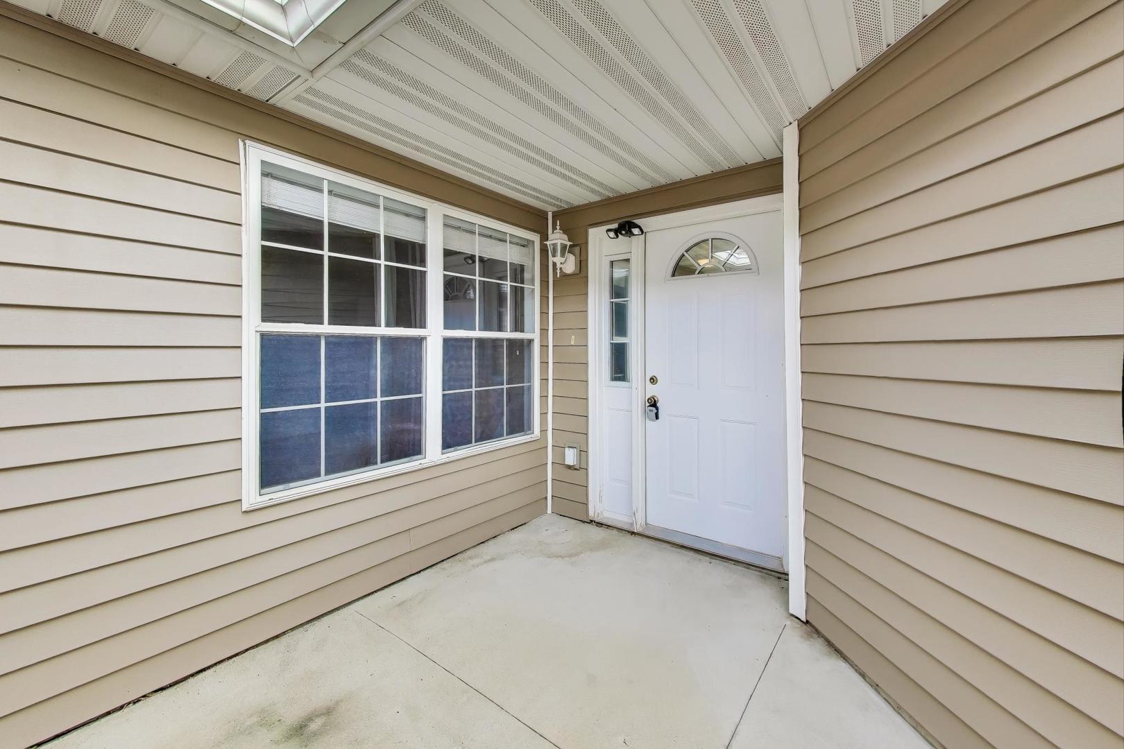 150 North Wooster Street, Unit 2 Capron, IL 61012 - Photo 2 of 17 a view of front door