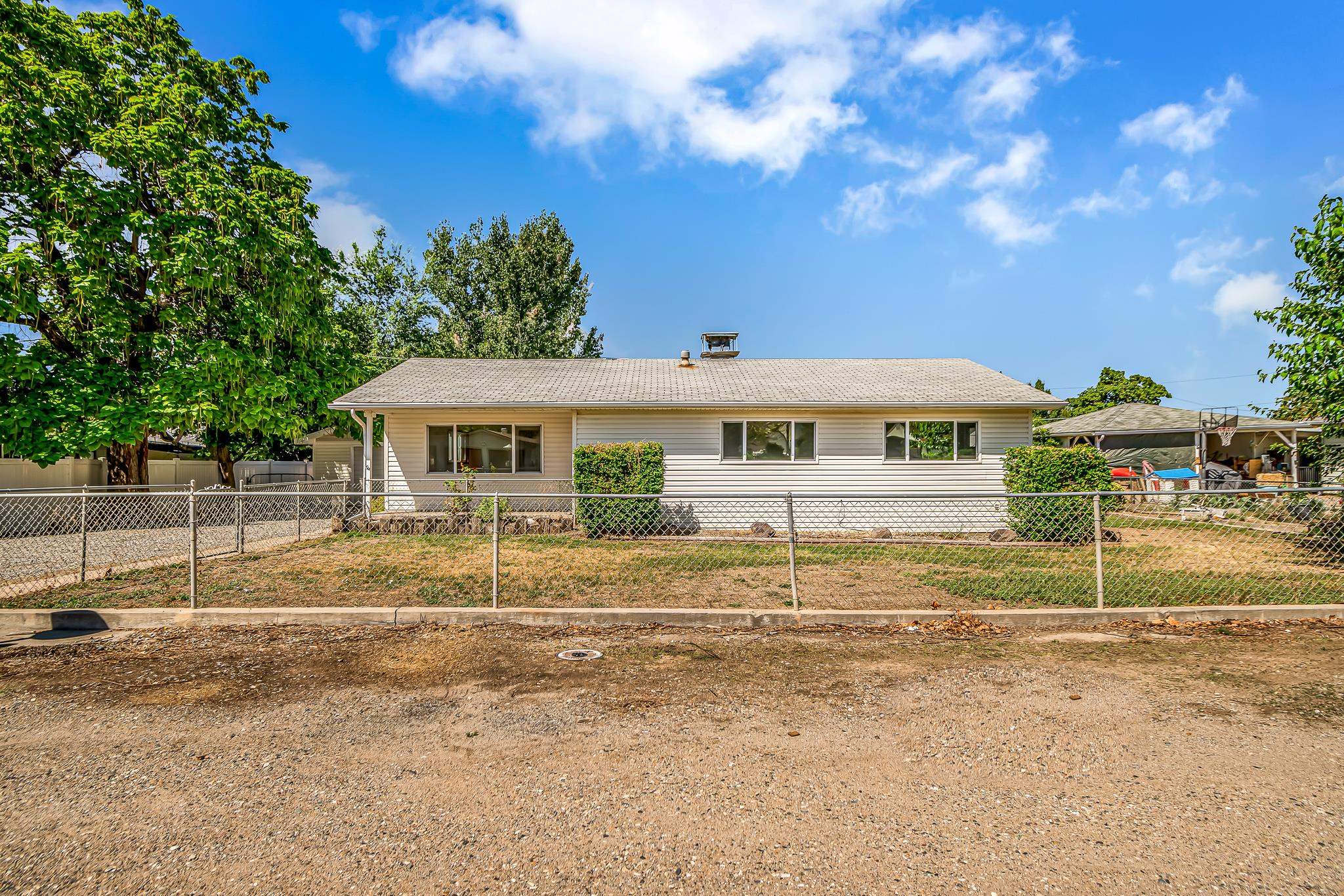 a front view of house with small garden