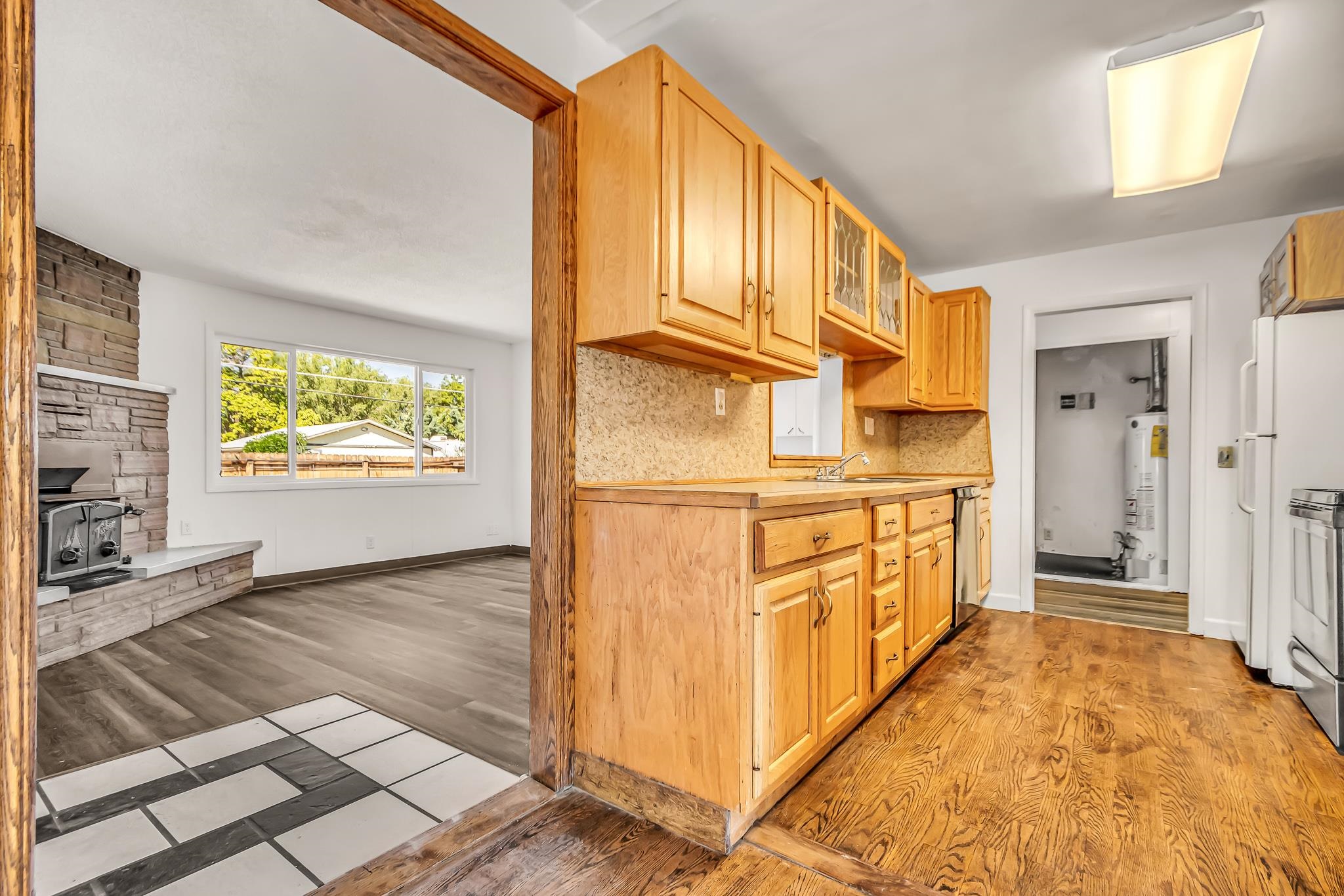 253 Nancy Street Grand Junction, CO 81503 - Photo 11 of 26 a view of a kitchen with stainless steel appliances wooden floor and a window