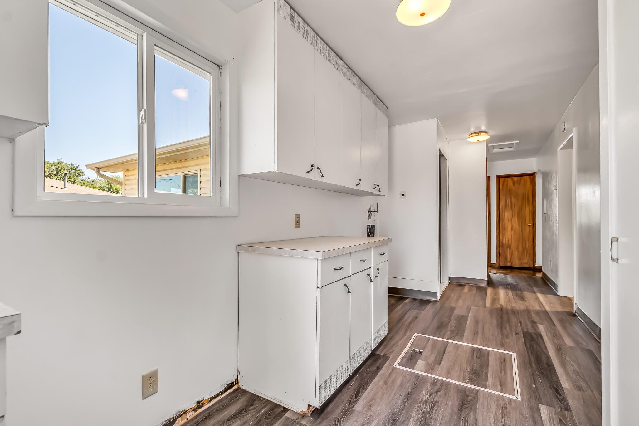 253 Nancy Street Grand Junction, CO 81503 - Photo 15 of 26 a hallway view with wooden floor and windows