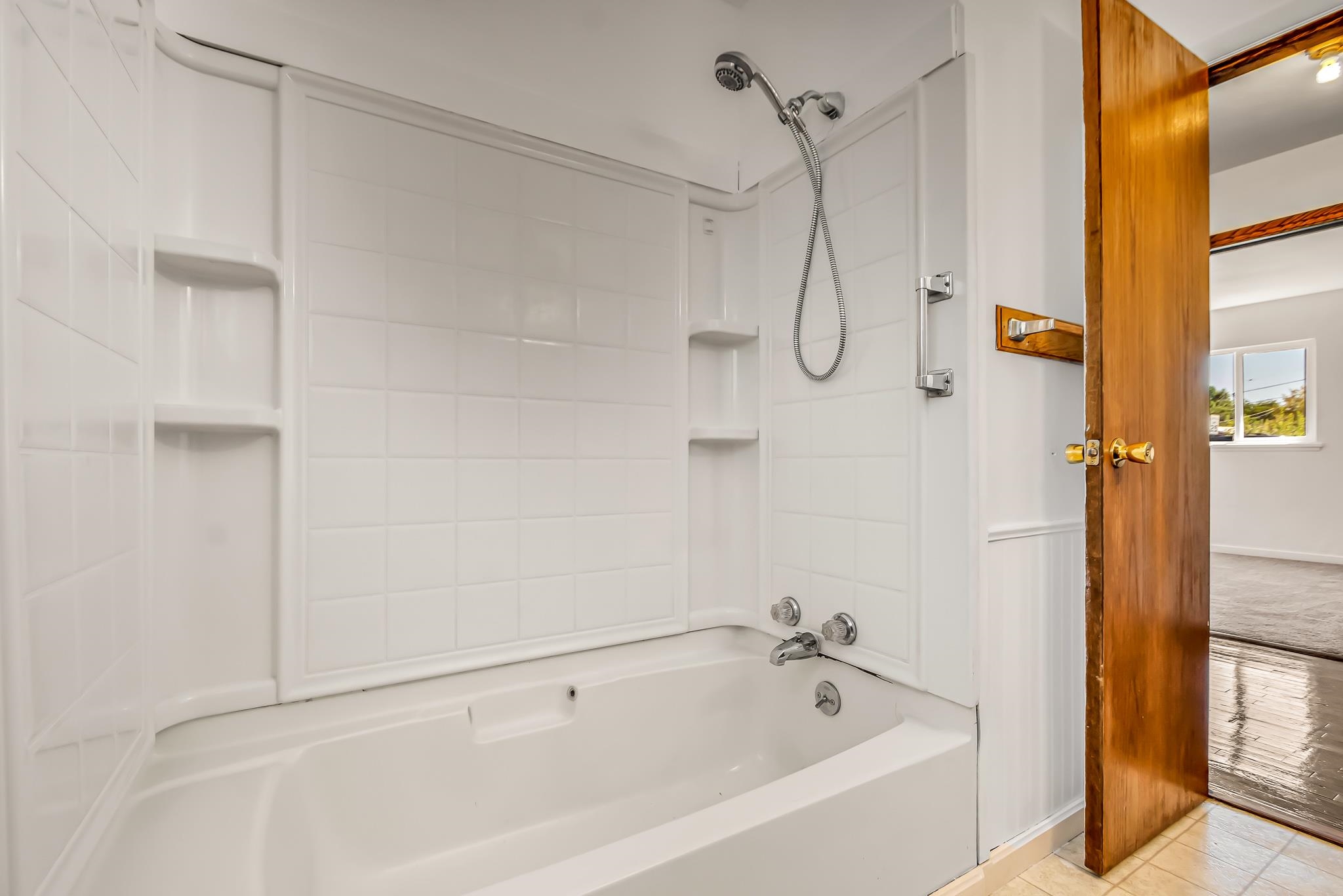 253 Nancy Street Grand Junction, CO 81503 - Photo 17 of 26 a bathroom with a bath tub with a shower
