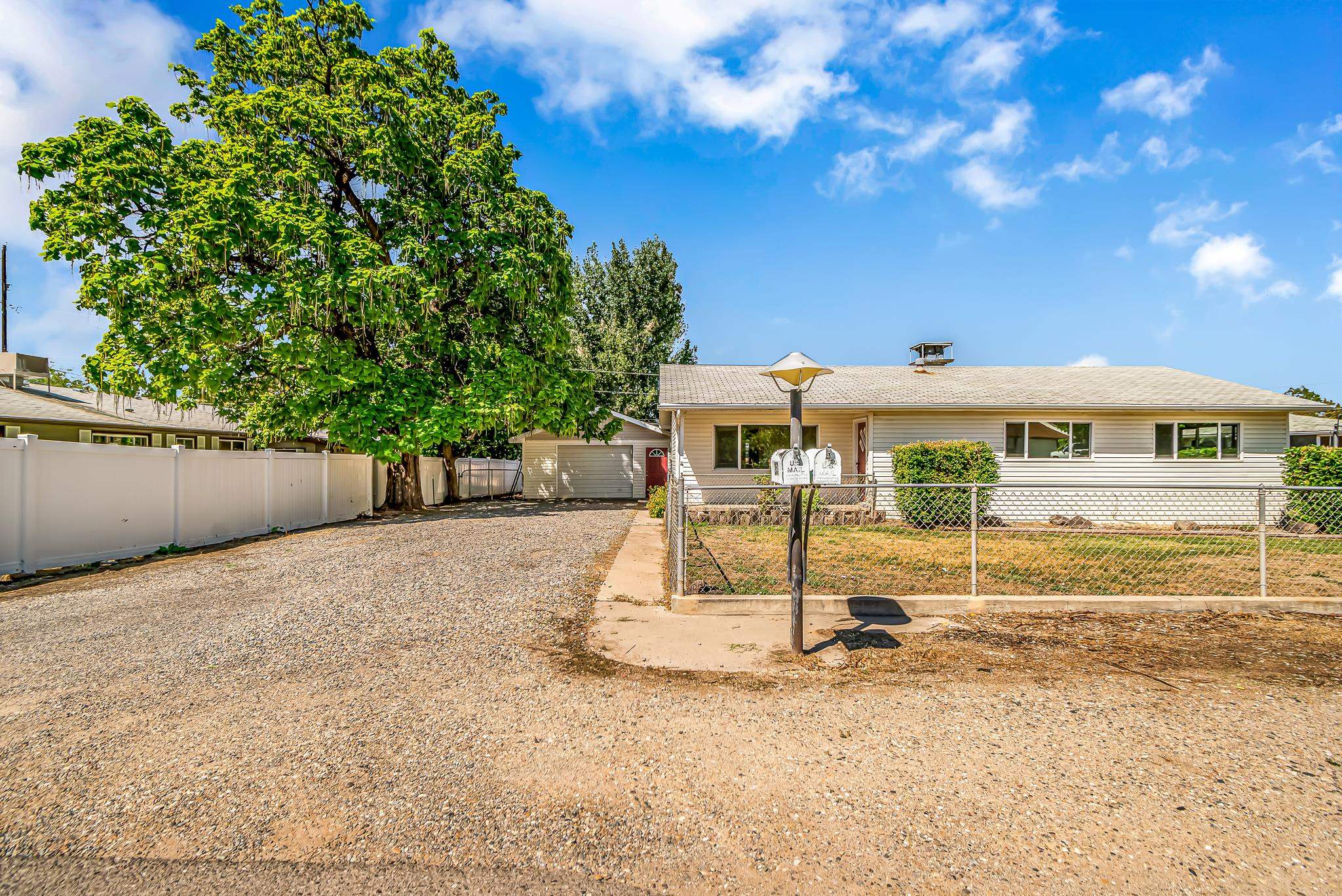 253 Nancy Street Grand Junction, CO 81503 - Photo 2 of 26 a front view of a house with a yard