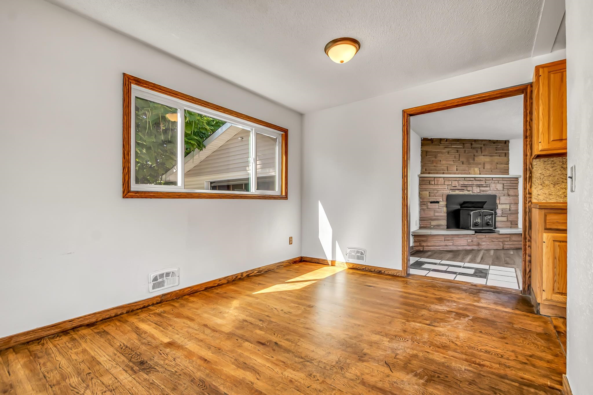 253 Nancy Street Grand Junction, CO 81503 - Photo 25 of 26 a view of an empty room with wooden floor and a window
