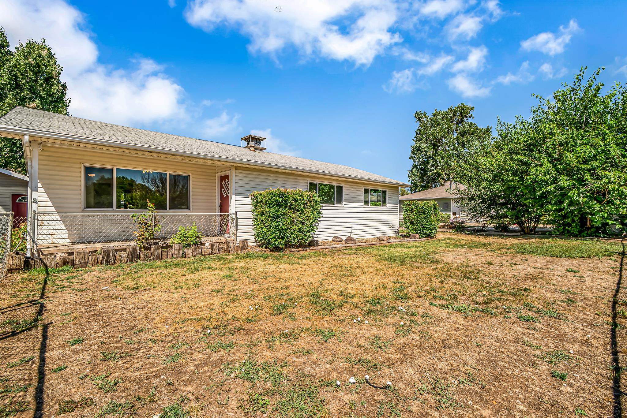 253 Nancy Street Grand Junction, CO 81503 - Photo 4 of 26 a house view with a backyard space