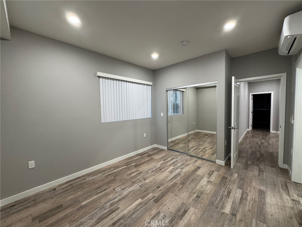 623 Normandie Avenue Los Angeles, CA 90004 - Photo 19 of 23 a view of hallway with wooden floor