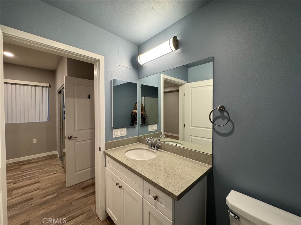 623 Normandie Avenue Los Angeles, CA 90004 - Photo 21 of 23 a bathroom with a sink a toilet and shower