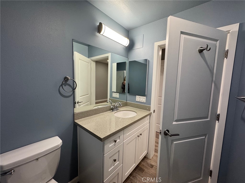 623 Normandie Avenue Los Angeles, CA 90004 - Photo 6 of 23 a bathroom with a granite countertop sink toilet and shower